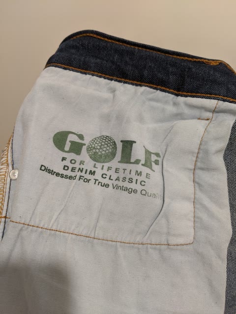 Interior denim construction showing seams, lining, and private label